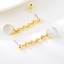 Show details for Nickel Free Gold Plated White Dangle Earrings with No-Risk Refund